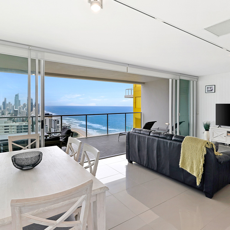 Coastal view apartment at ULTIQA Air on Broadbeach featuring spacious living and dining areas with balcony.