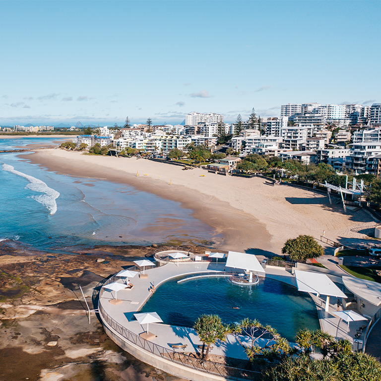 Aerial view of Caloundra beach and oceanfront pool.