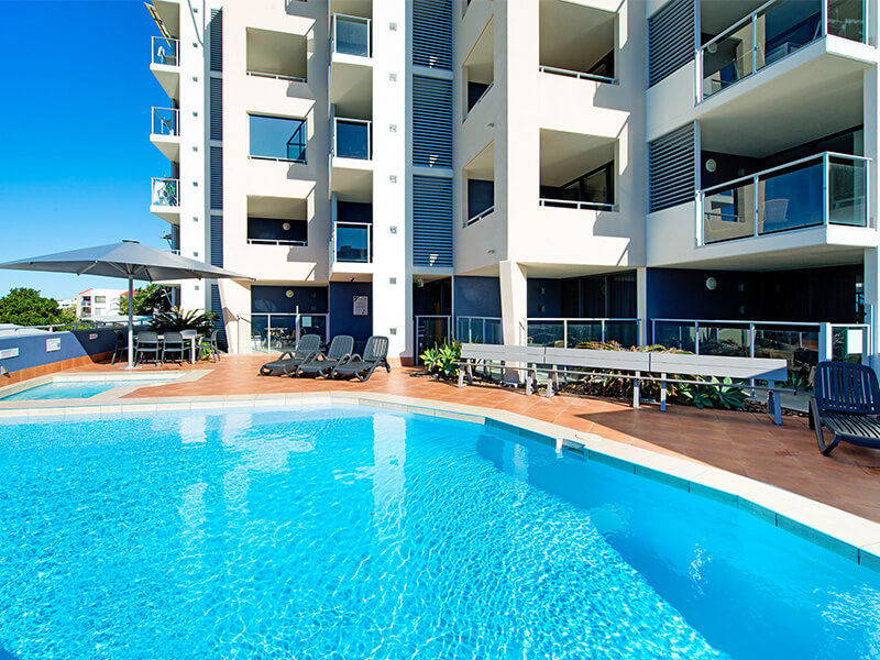 Outdoor pool area at ULTIQA Shearwater Resort.