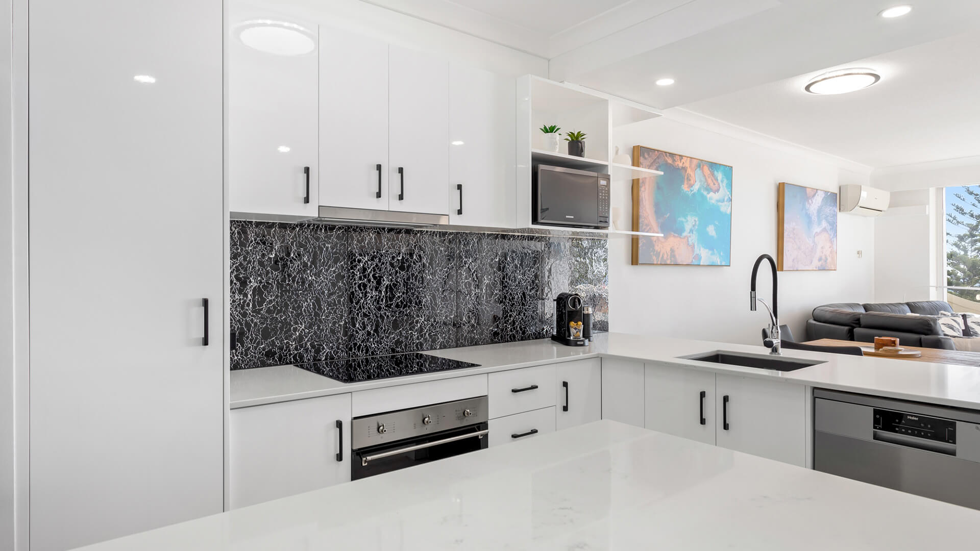 Modern fully equipped kitchen in 1 Bedroom Superior Ocean View Apartment at ULTIQA Burleigh Mediterranean Resort.