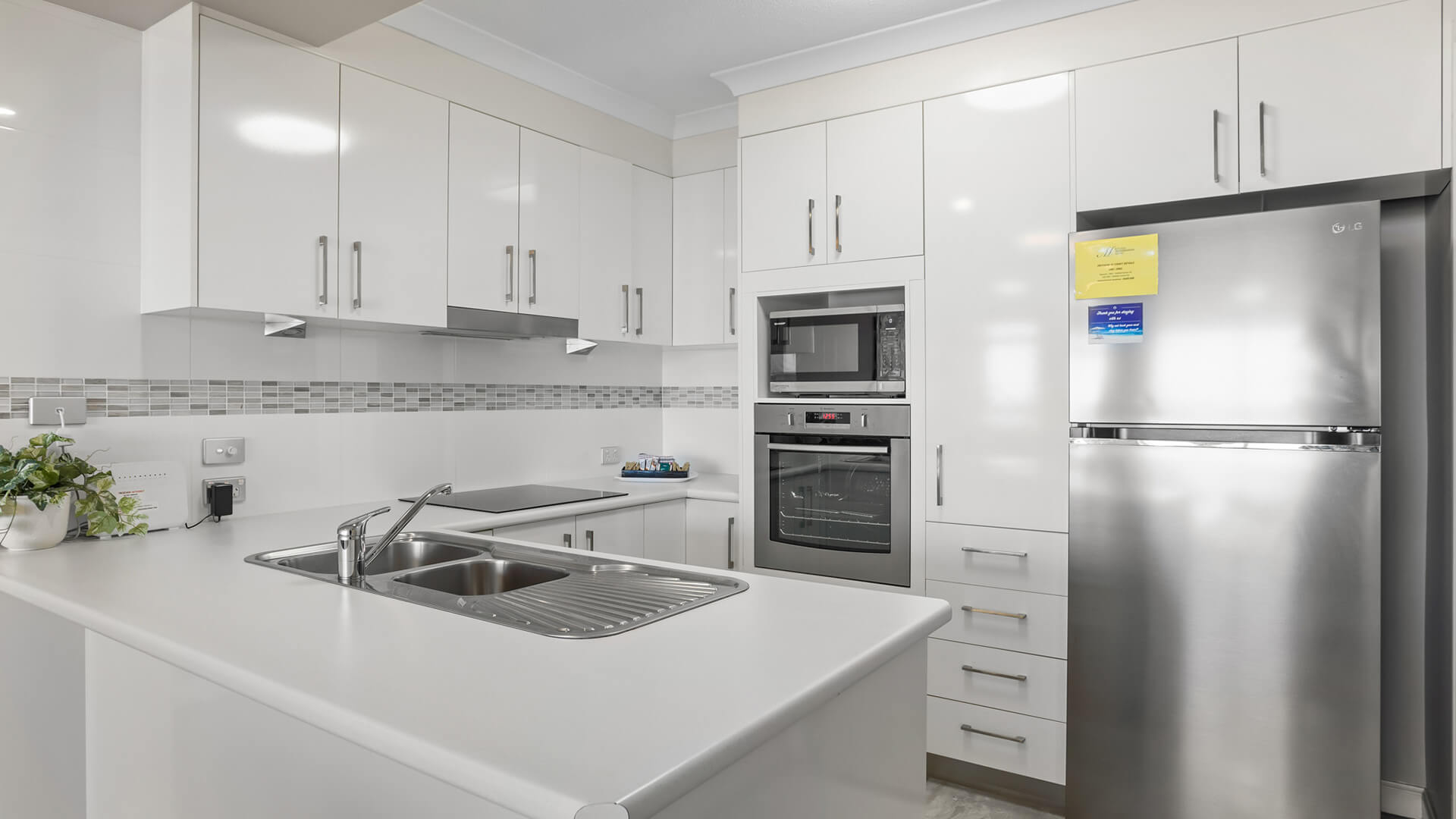 Fully equipped kitchen in 2 Bedroom Garden View Apartment at ULTIQA Burleigh Mediterranean Resort.