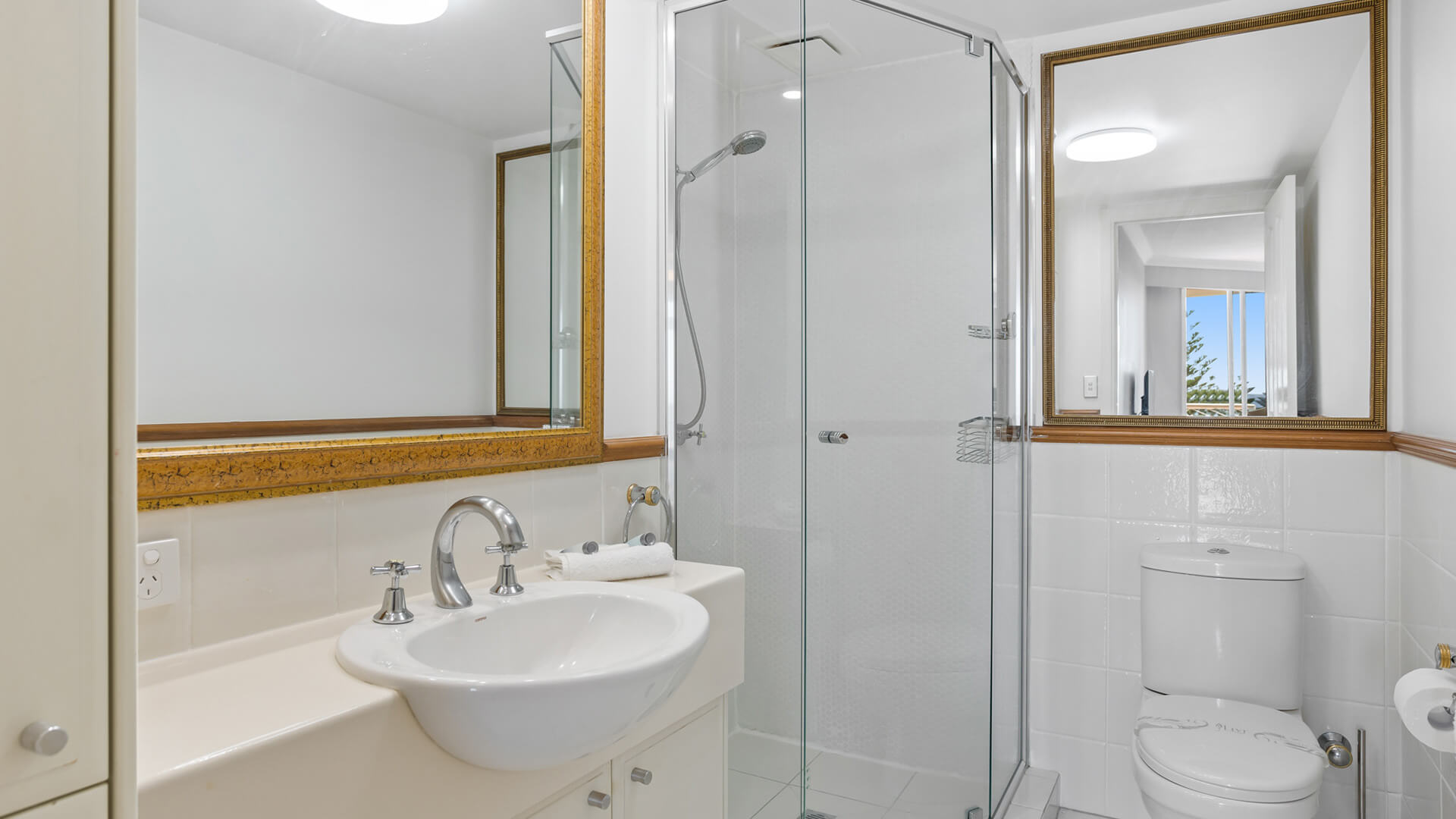 Bathroom with walk-in shower in 2 Bedroom Garden View Apartment at ULTIQA Burleigh Mediterranean Resort.