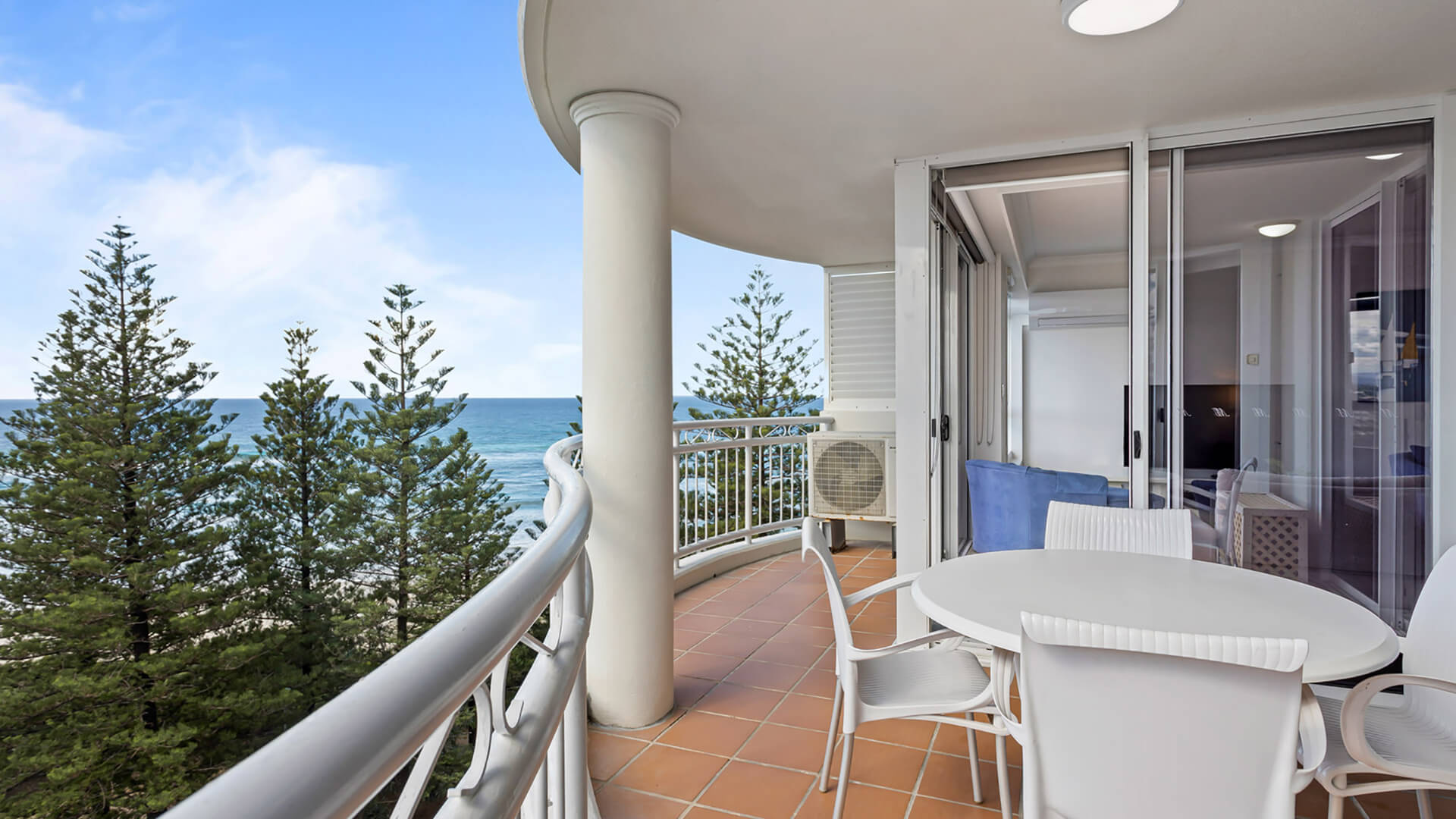 Private balcony with outdoor dining and ocean views in 2 Bedroom Apartment at ULTIQA Burleigh Mediterranean Resort.