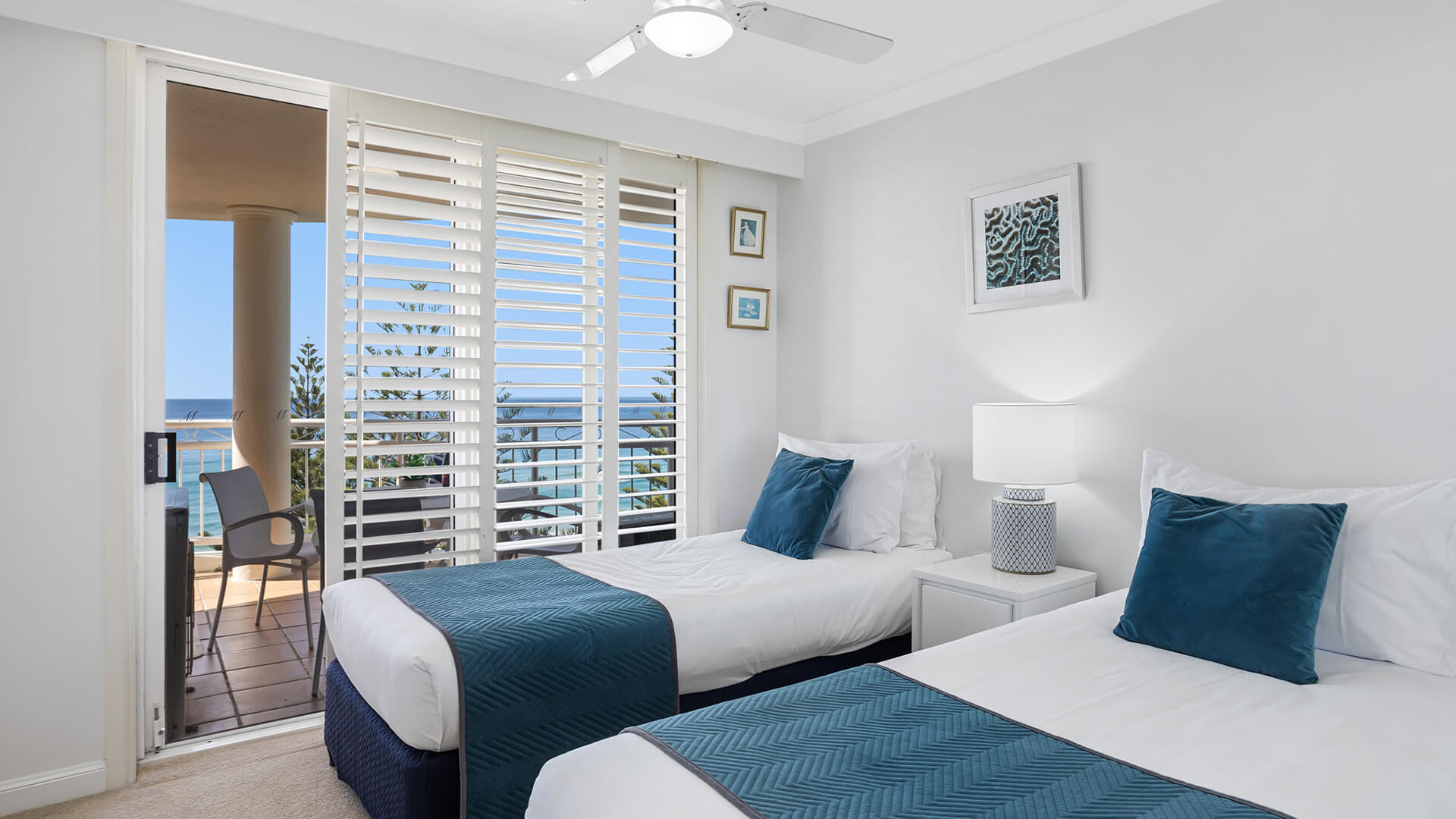 Twin bedroom with balcony and ocean views in 2 Bedroom Apartment at ULTIQA Burleigh Mediterranean Resort.