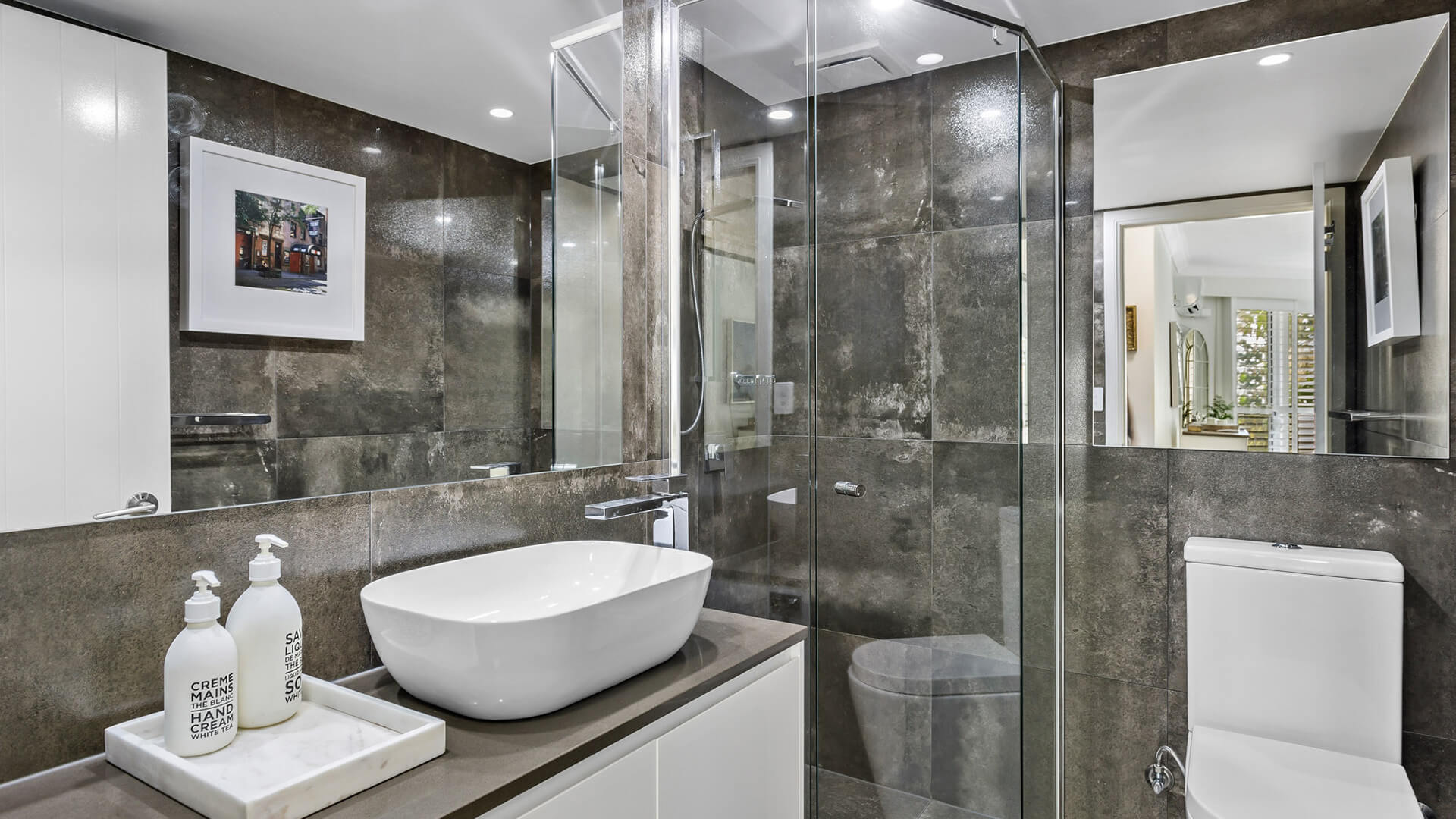 Modern bathroom with walk-in shower in 2 Bedroom Superior Apartment at ULTIQA Burleigh Mediterranean Resort.