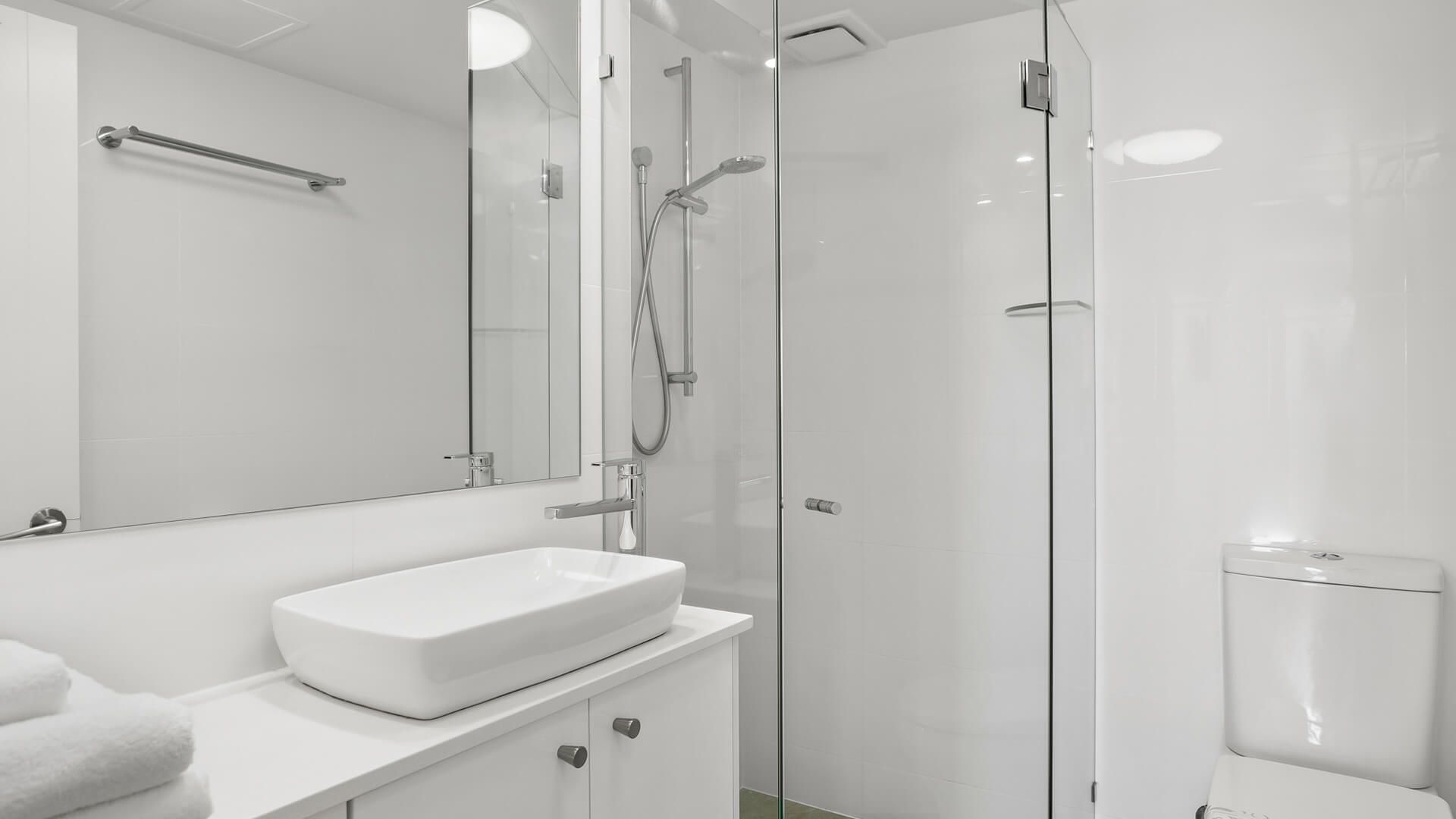 Modern bathroom with walk-in shower in 2 Bedroom Superior Ocean View Apartment at ULTIQA Burleigh Mediterranean Resort.
