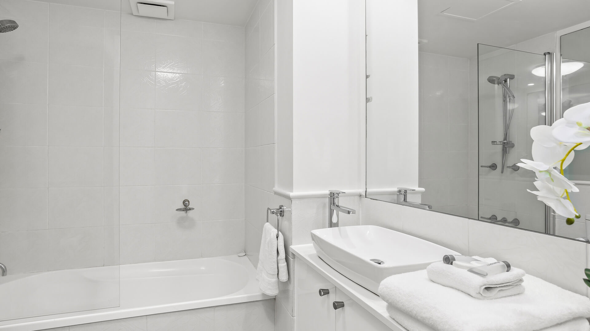 Bathroom with bathtub and shower in 2 Bedroom Superior Ocean View Apartment at ULTIQA Burleigh Mediterranean Resort.