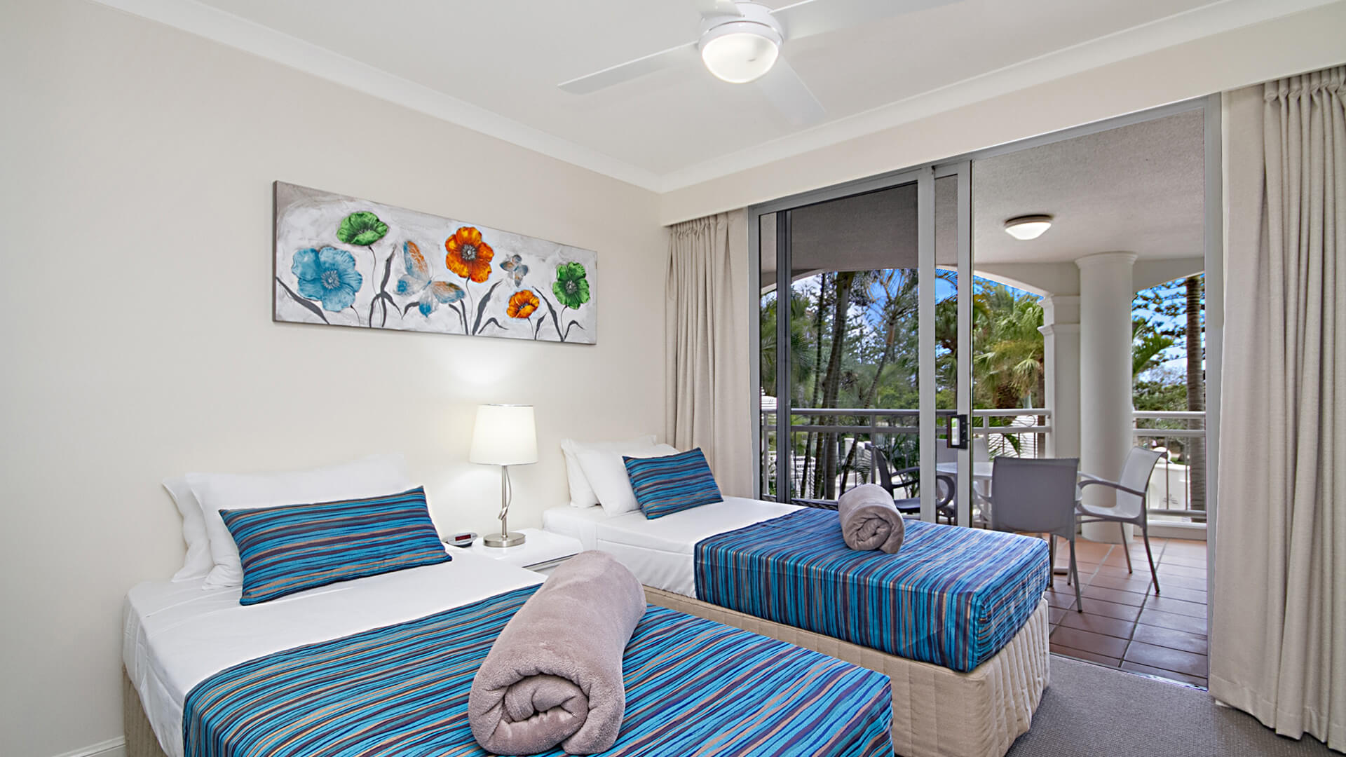 Twin bedroom with private balcony access in 3 Bedroom Apartment at ULTIQA Burleigh Mediterranean Resort.