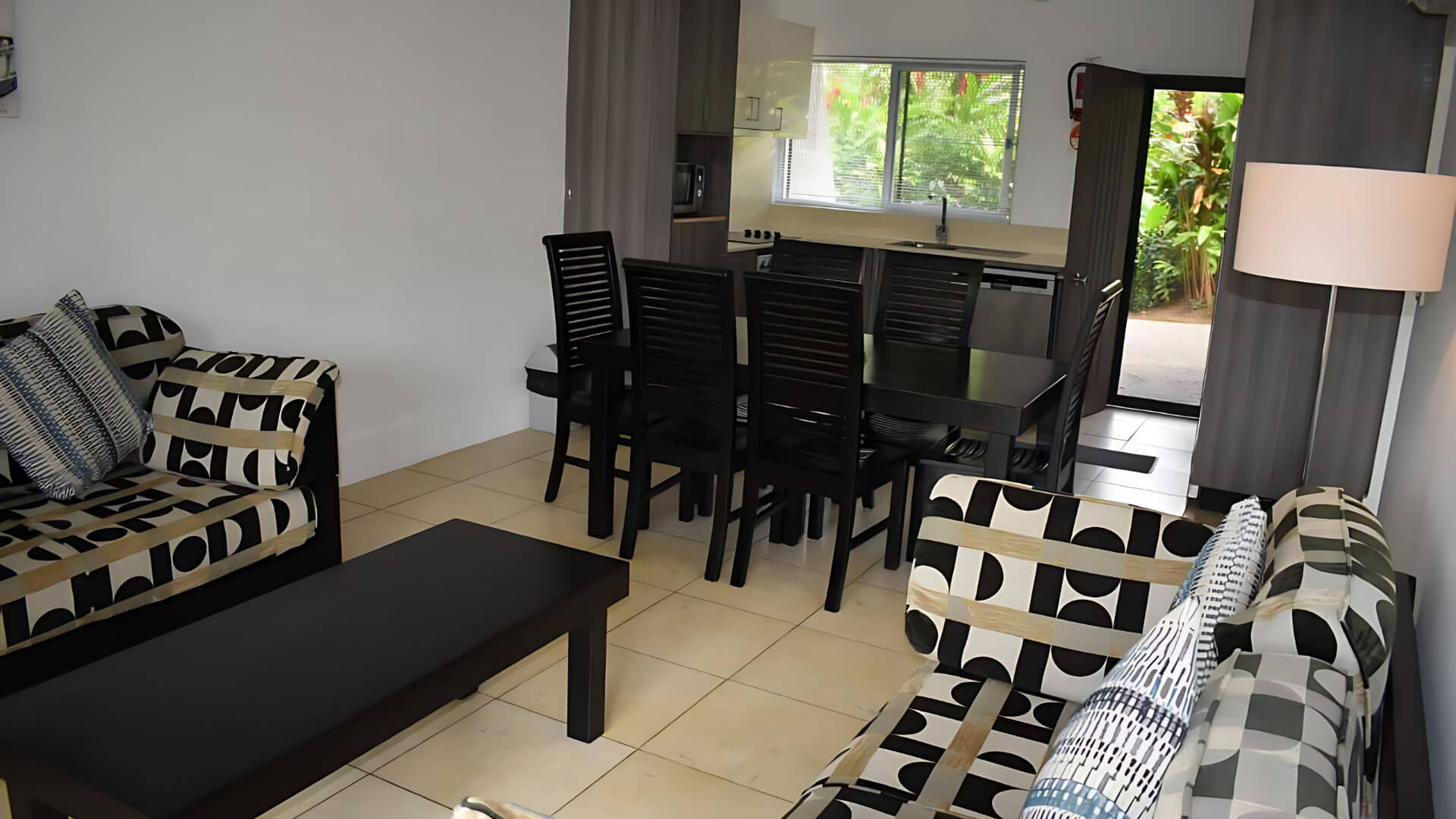 Open-plan living, dining, and kitchen area in Standard 2 Bedroom 1 Bathroom Apartment at ULTIQA Fiji.