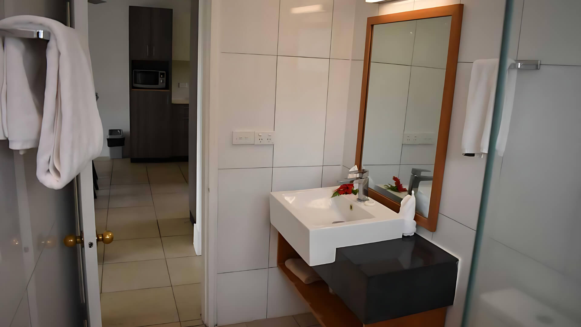 Bathroom with vanity and mirror in Standard 2 Bedroom 1 Bathroom Apartment at ULTIQA Fiji.