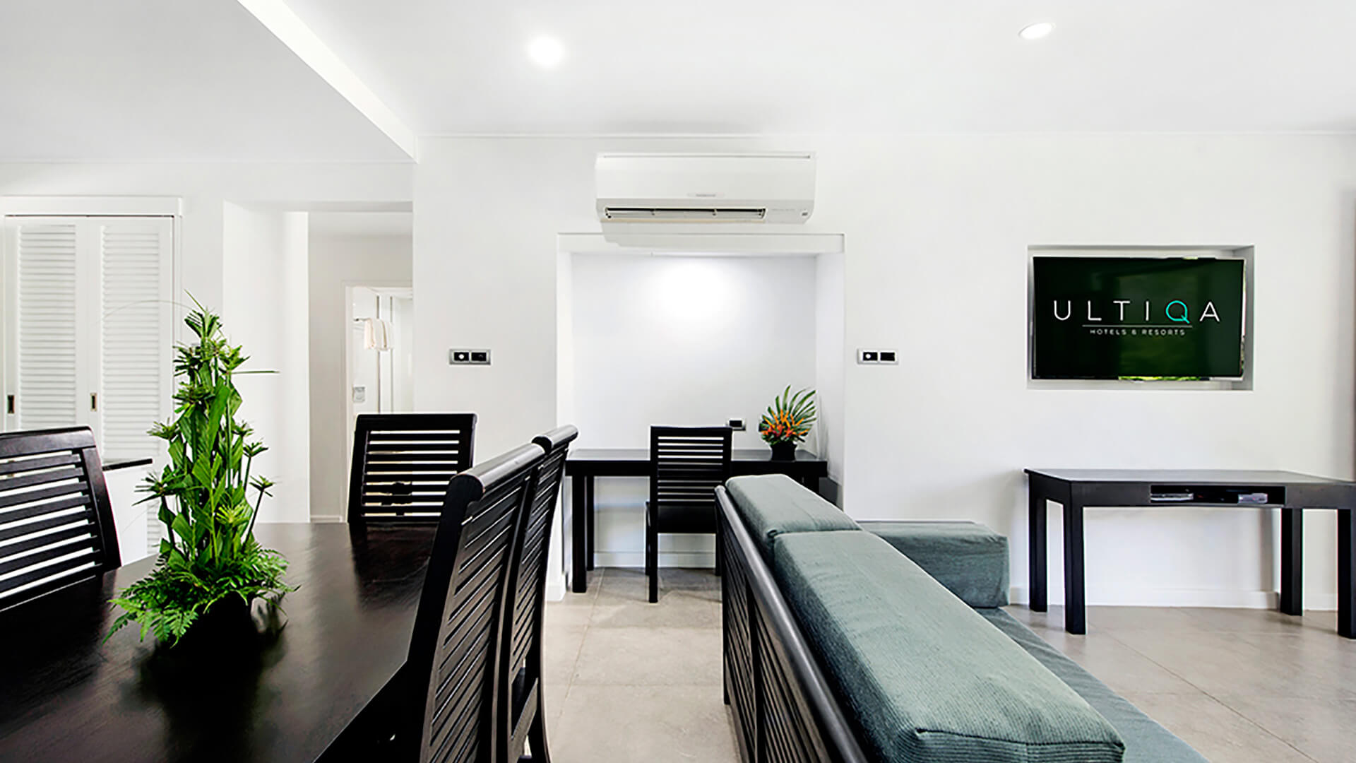 Modern 2 Bedroom Apartment at ULTIQA Fiji with dining area, work desk, and open living space.