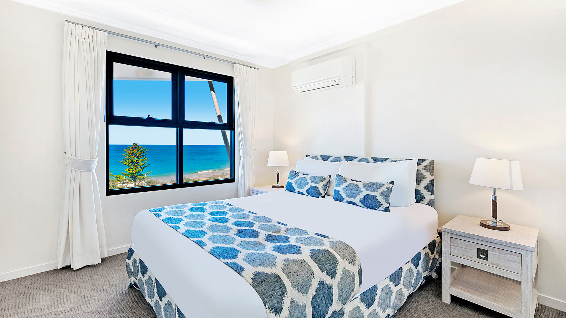Bedroom with ocean views in 1 Bedroom Apartment at ULTIQA Shearwater Resort.
