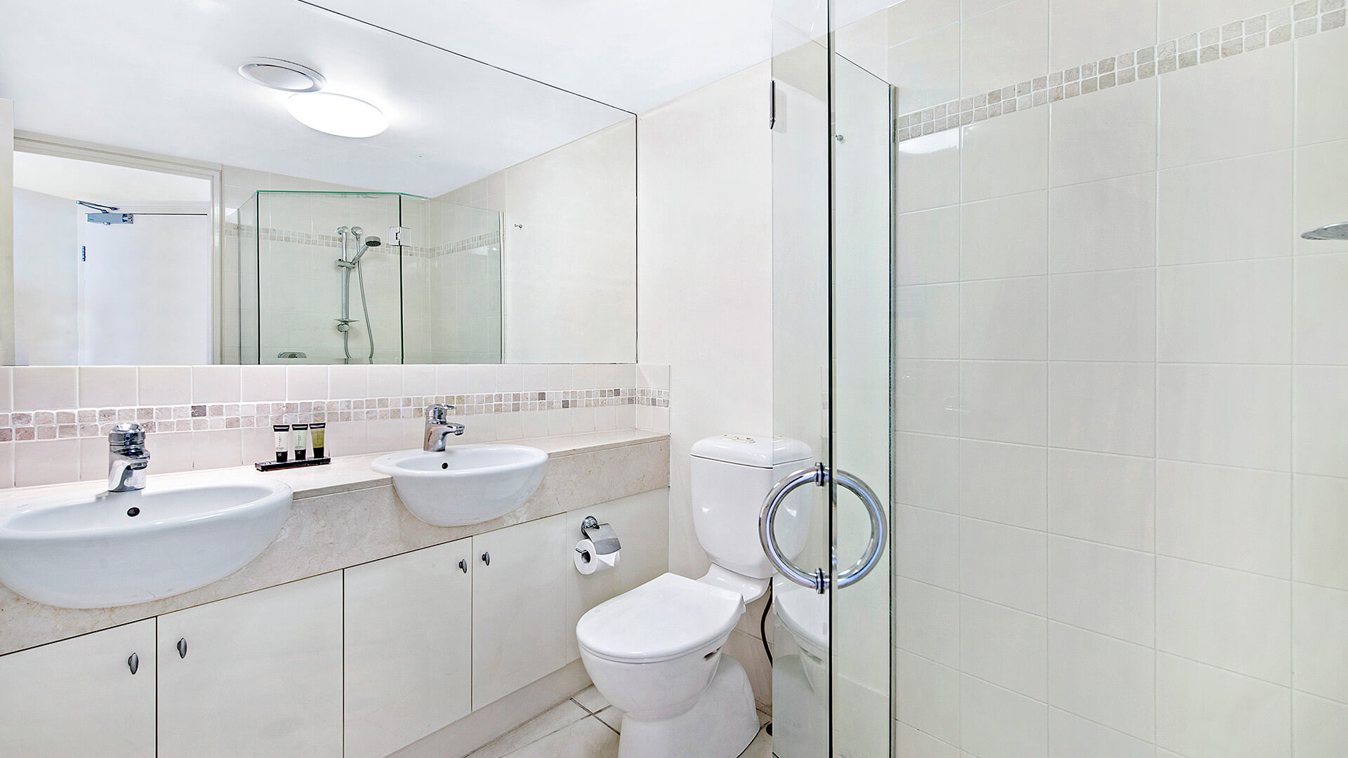 Bathroom with double vanity in 1 Bedroom Apartment at ULTIQA Shearwater Resort.
