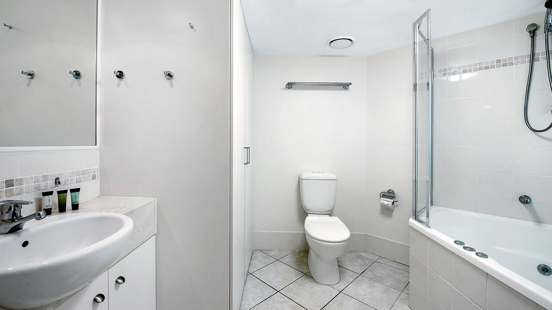 Bathroom with shower-over-bath in 1 Bedroom Apartment at ULTIQA Shearwater Resort.
