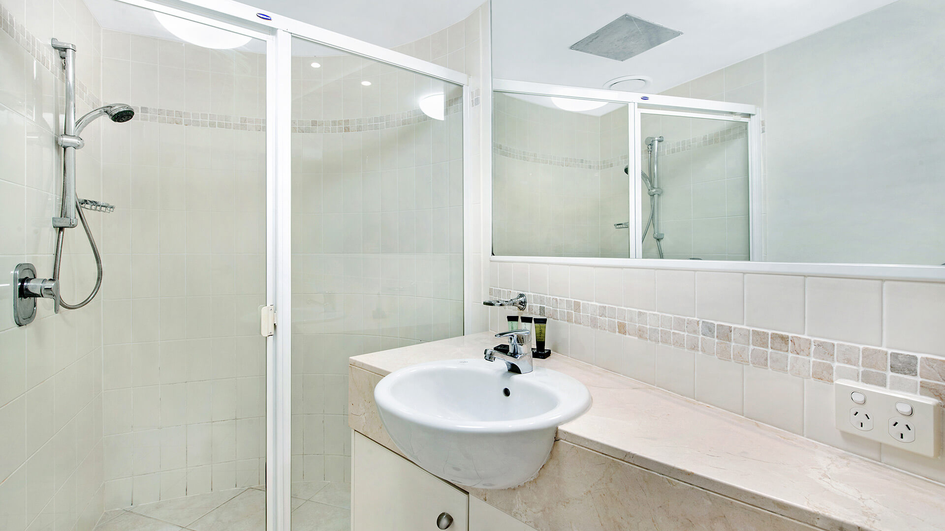 Bathroom with vanity and walk-in shower in 2 Bedroom Apartment at ULTIQA Shearwater Resort.