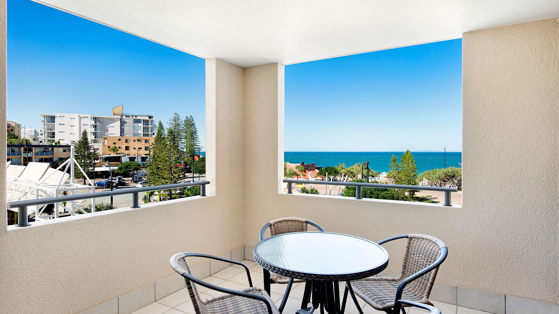 Private balcony with outdoor seating and ocean views in 2 Bedroom Apartment at ULTIQA Shearwater Resort.