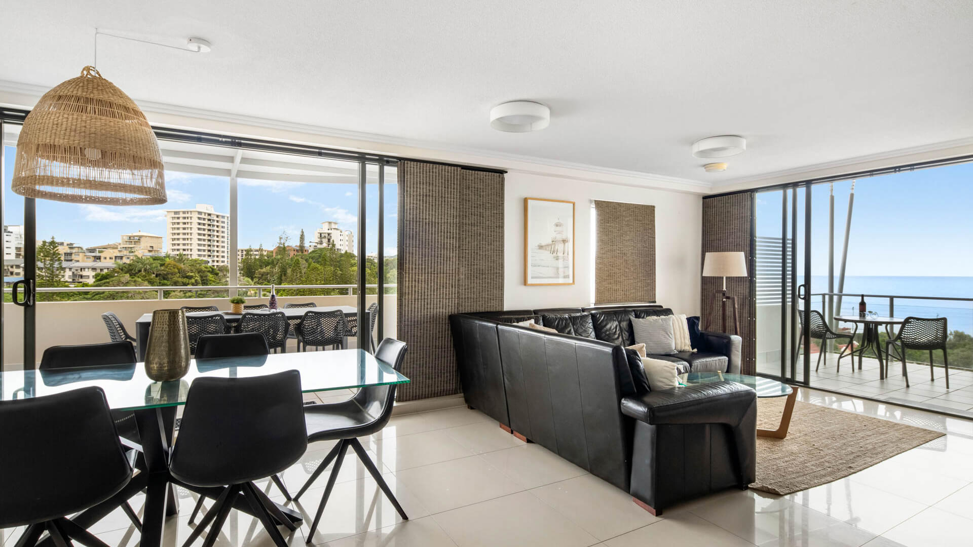 Spacious living and dining area with dual balconies and ocean views in 3 Bedroom Penthouse at ULTIQA Shearwater Resort.