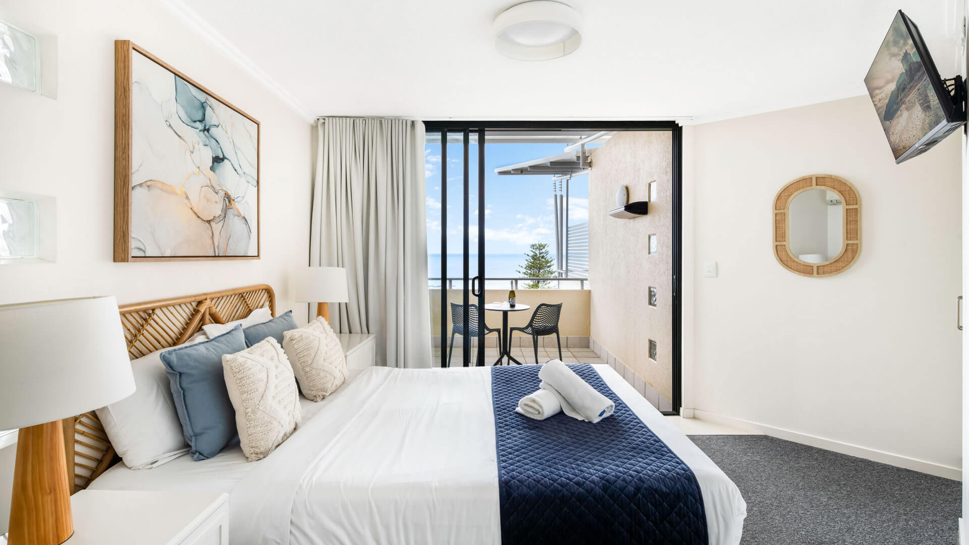 Bedroom with ocean-view balcony in 3 Bedroom Penthouse at ULTIQA Shearwater Resort.