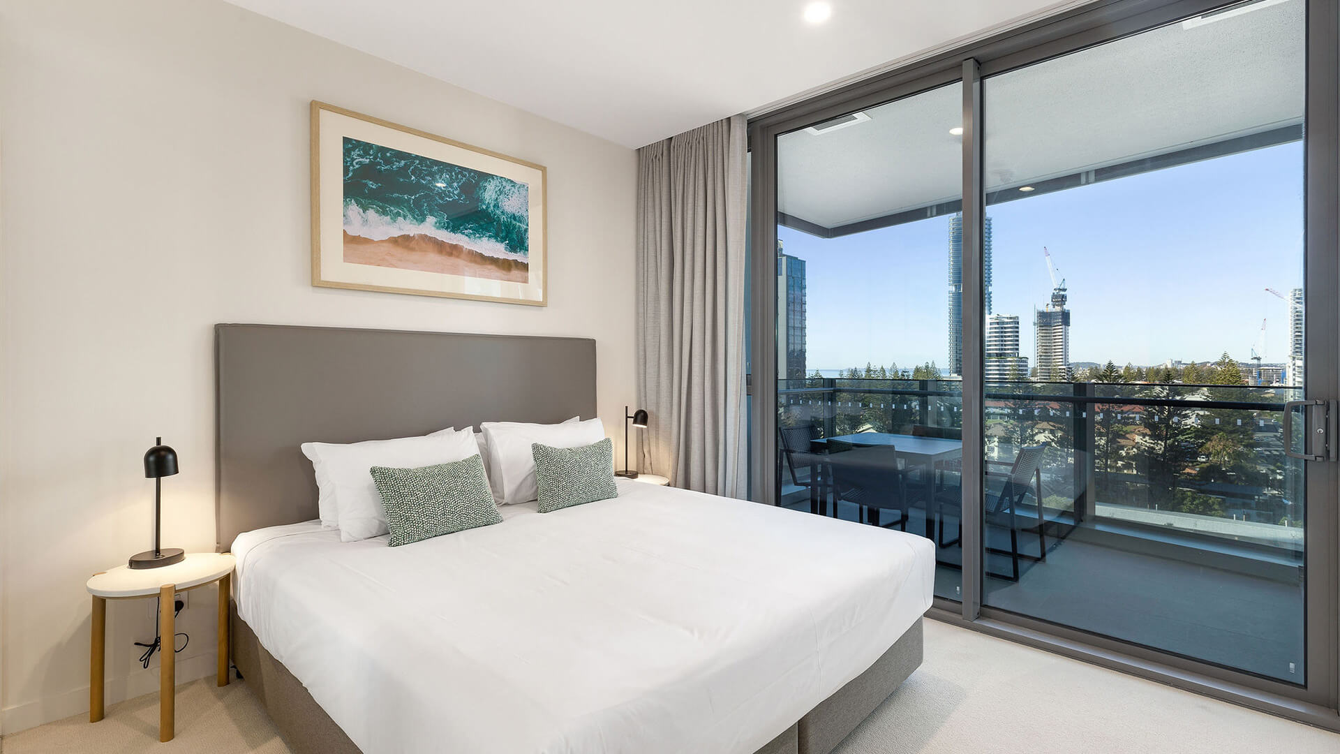 Bedroom with king bed and balcony access in the 1 Bedroom Suite at ULTIQA Signature at Broadbeach.