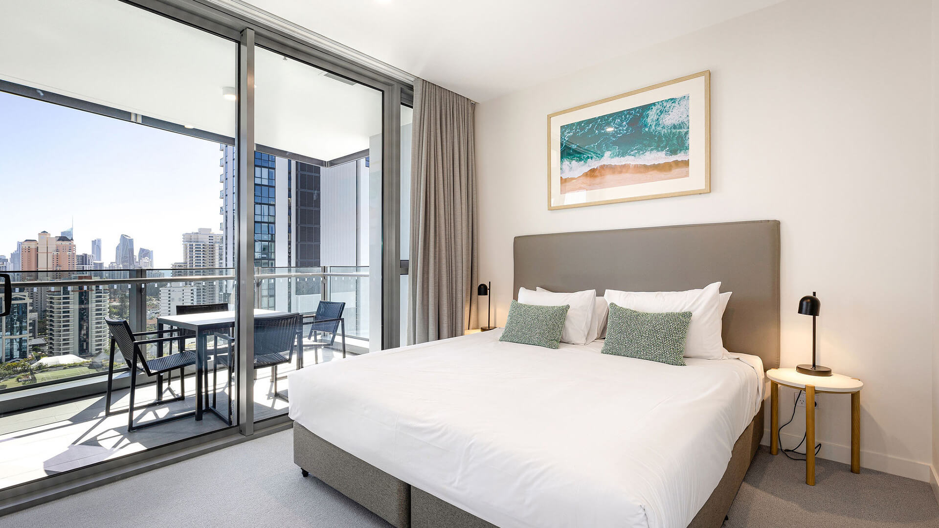 Bedroom with king bed and private balcony access in the 2 Bedroom Suite at ULTIQA Signature at Broadbeach.