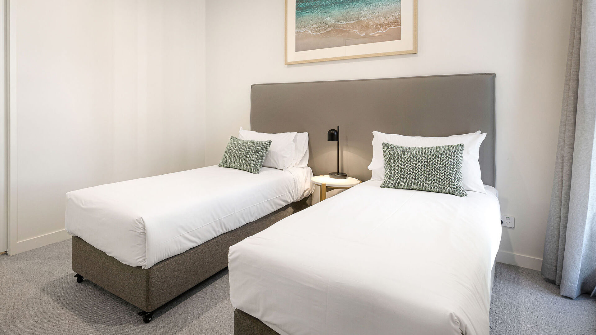 Second bedroom with two single beds in the 2 Bedroom Suite at ULTIQA Signature at Broadbeach.