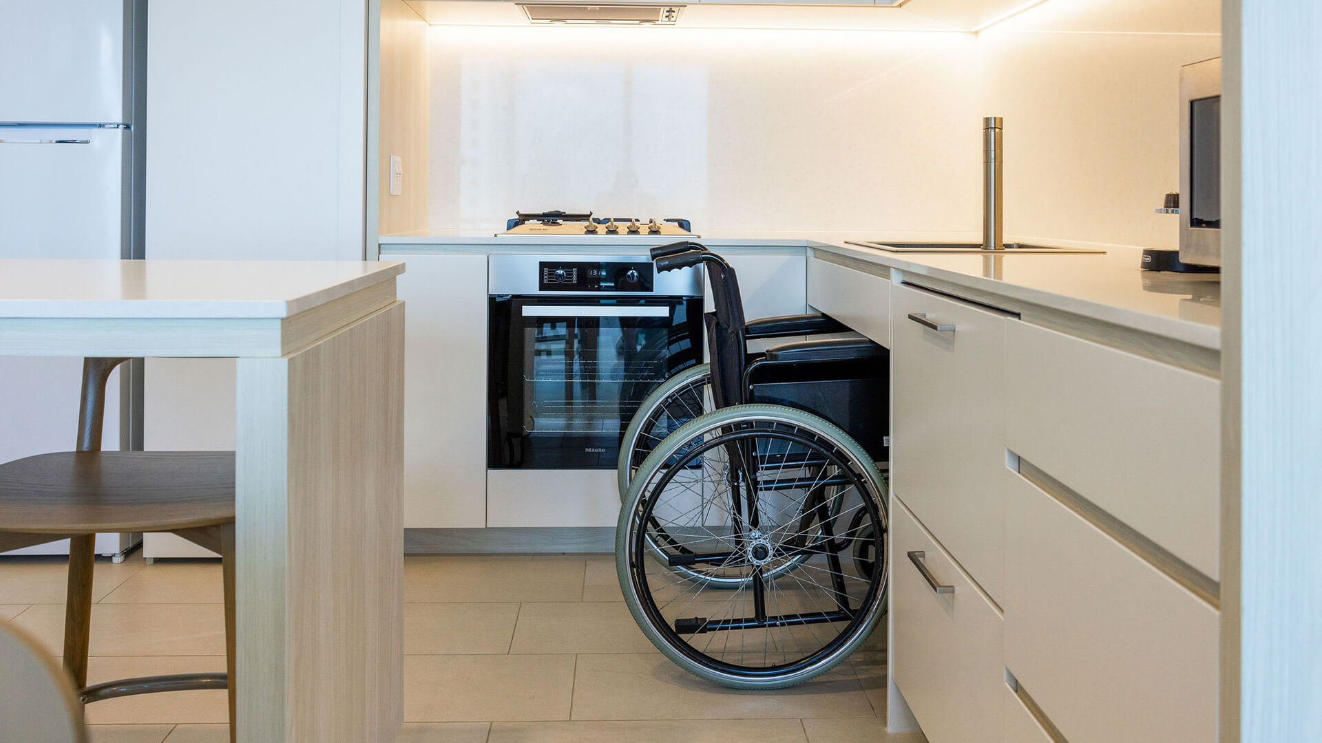 Wheelchair-accessible kitchen in 2 Bedroom Accessible Suite at ULTIQA Signature at Broadbeach.
