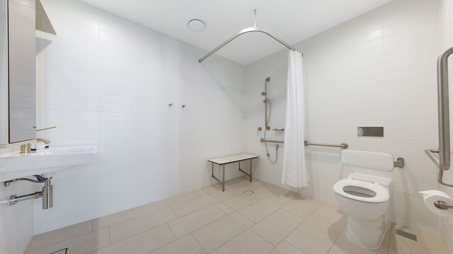 Accessible bathroom with roll-in shower in 2 Bedroom Accessible Suite at ULTIQA Signature at Broadbeach.