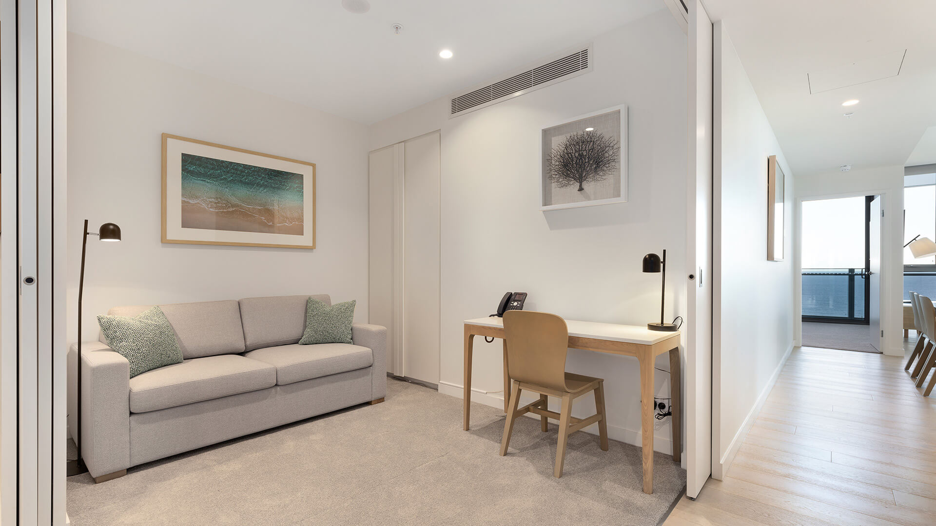 Study and lounge area with sofa bed in the 2 Bedroom Ocean View Suite Premium at ULTIQA Signature at Broadbeach.