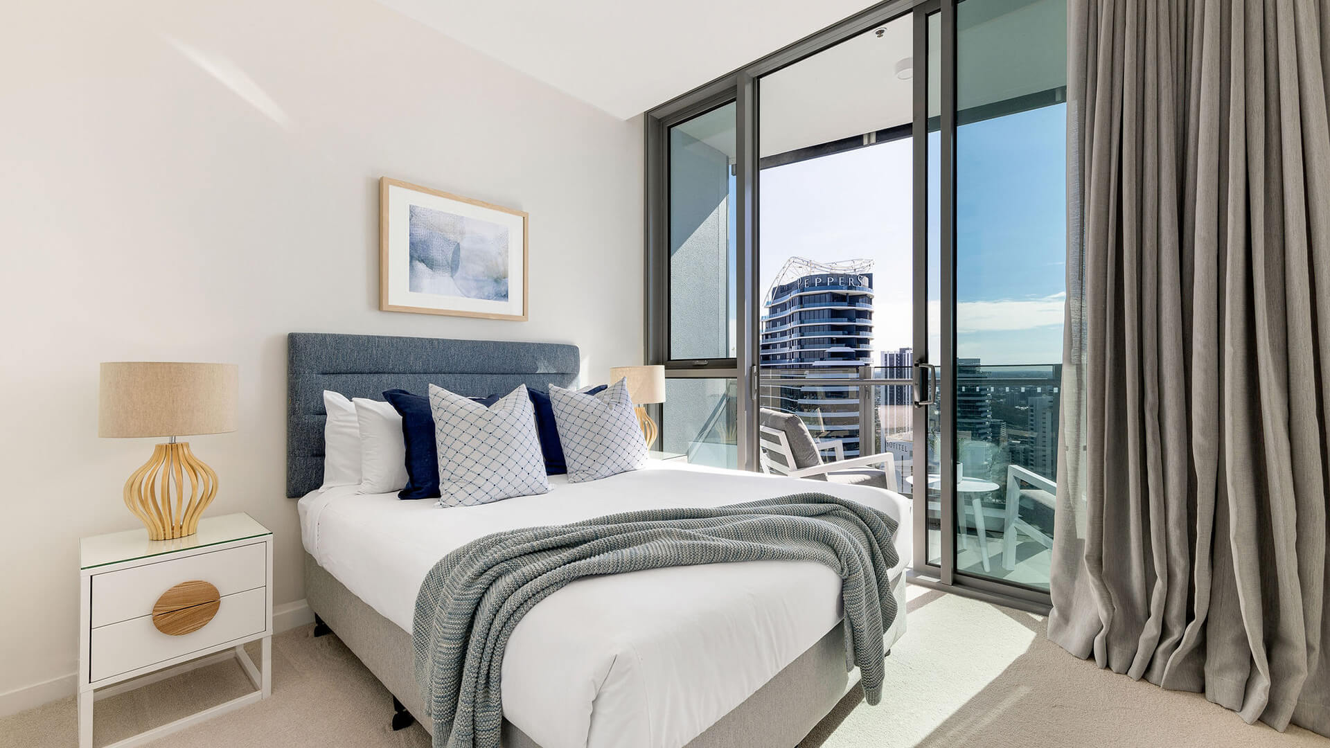 Bedroom in 3 Bedroom Ocean Sub-Penthouse at ULTIQA Signature at Broadbeach with private balcony access.