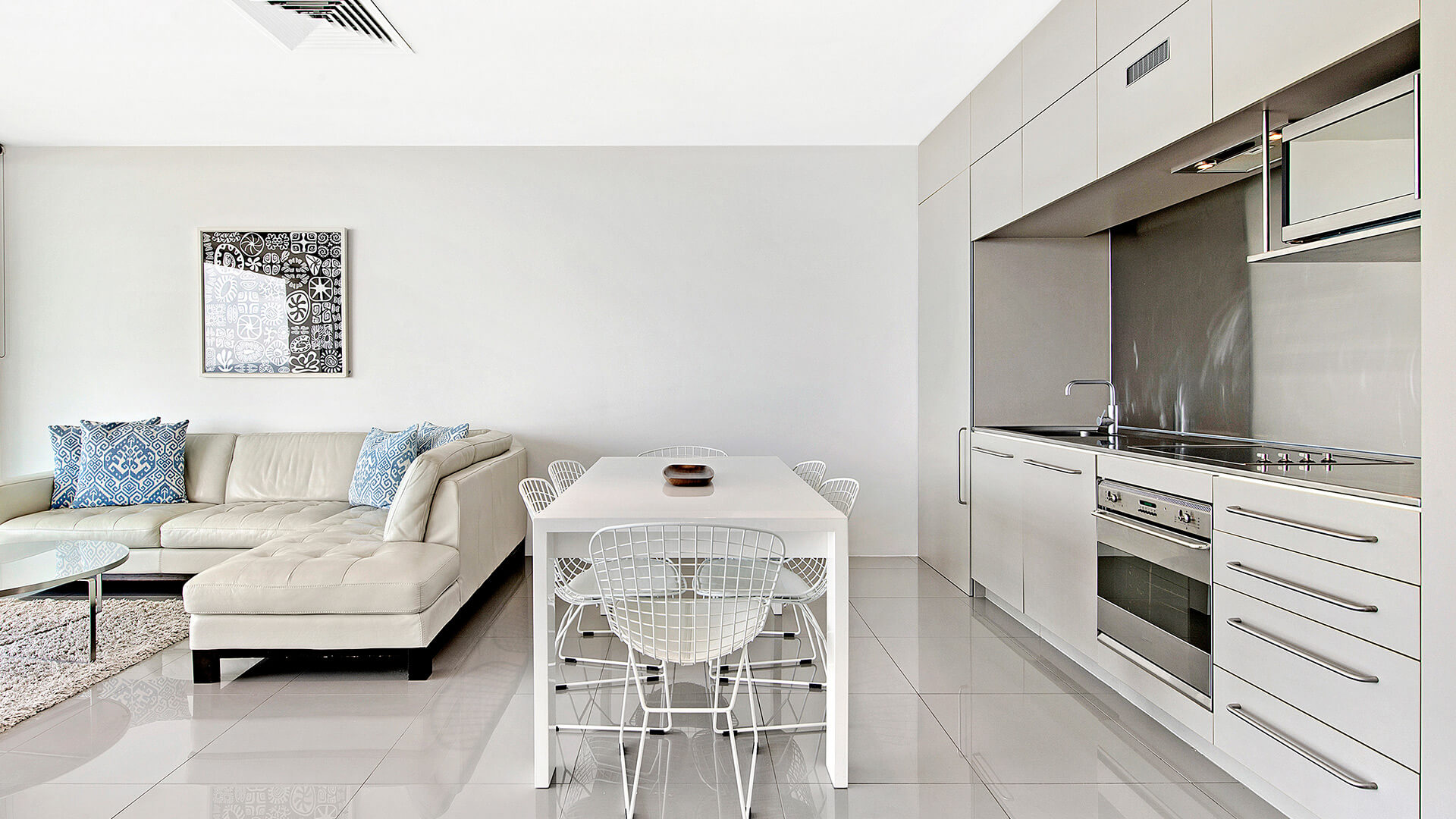 Open-plan kitchen, dining and lounge in 1 Bedroom Ocean View Apartment at ULTIQA Air on Broadbeach.