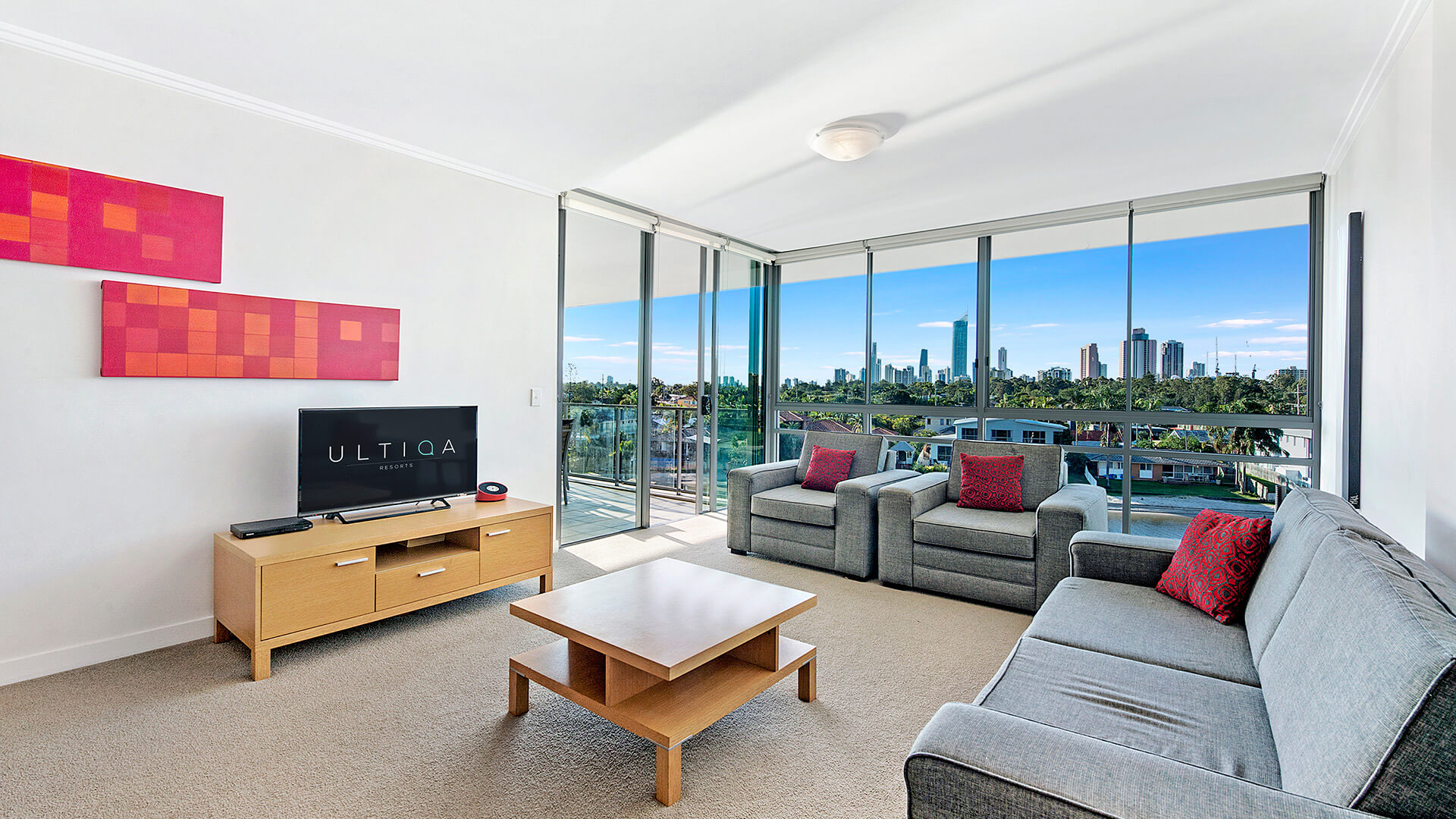 Spacious lounge in the 2 Bedroom Apartment at ULTIQA Freshwater Point Resort with skyline views and natural light.