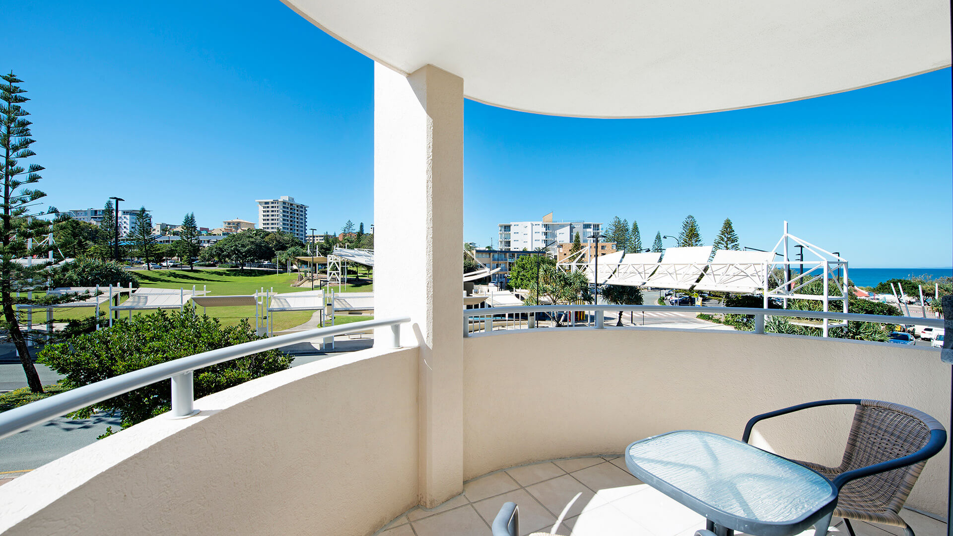 Private balcony with outdoor seating and ocean glimpses in 3 Bedroom Dual Key Apartment at ULTIQA Shearwater Resort.